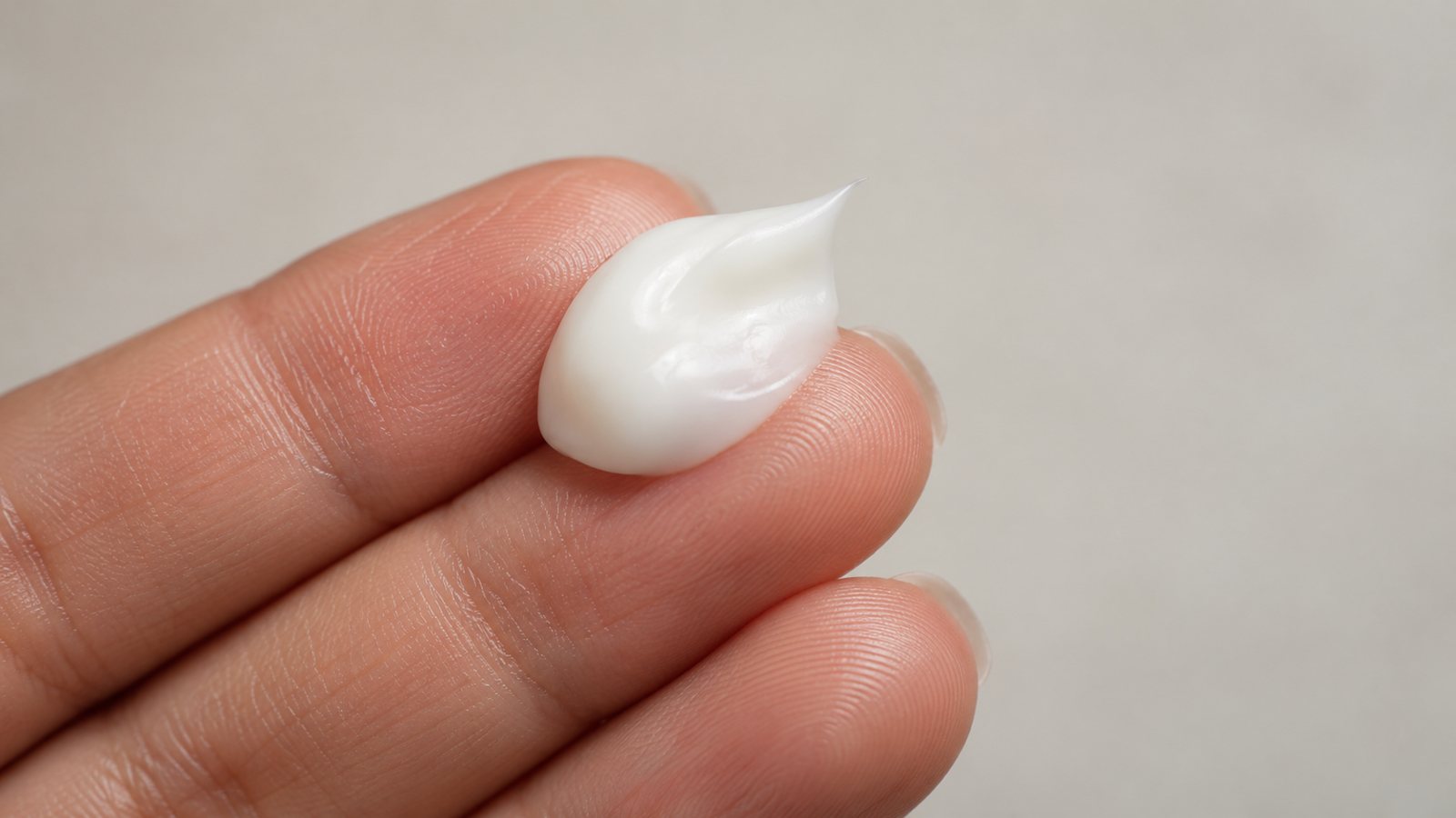 Lotion on a fingertip (illustrative)